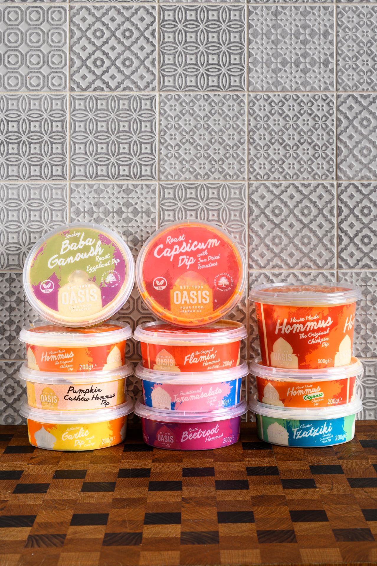 Stack of Oasis hommus and dip tubs