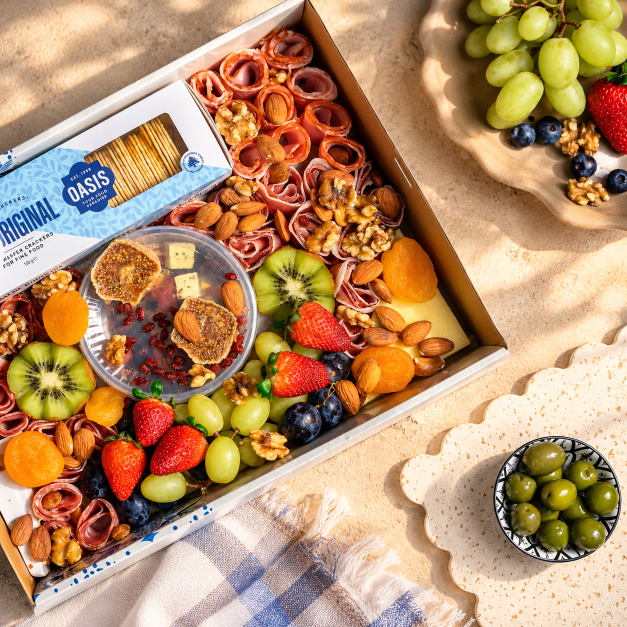 Oasis charcuterie grazing box with cheese, fruit, nuts and crackers